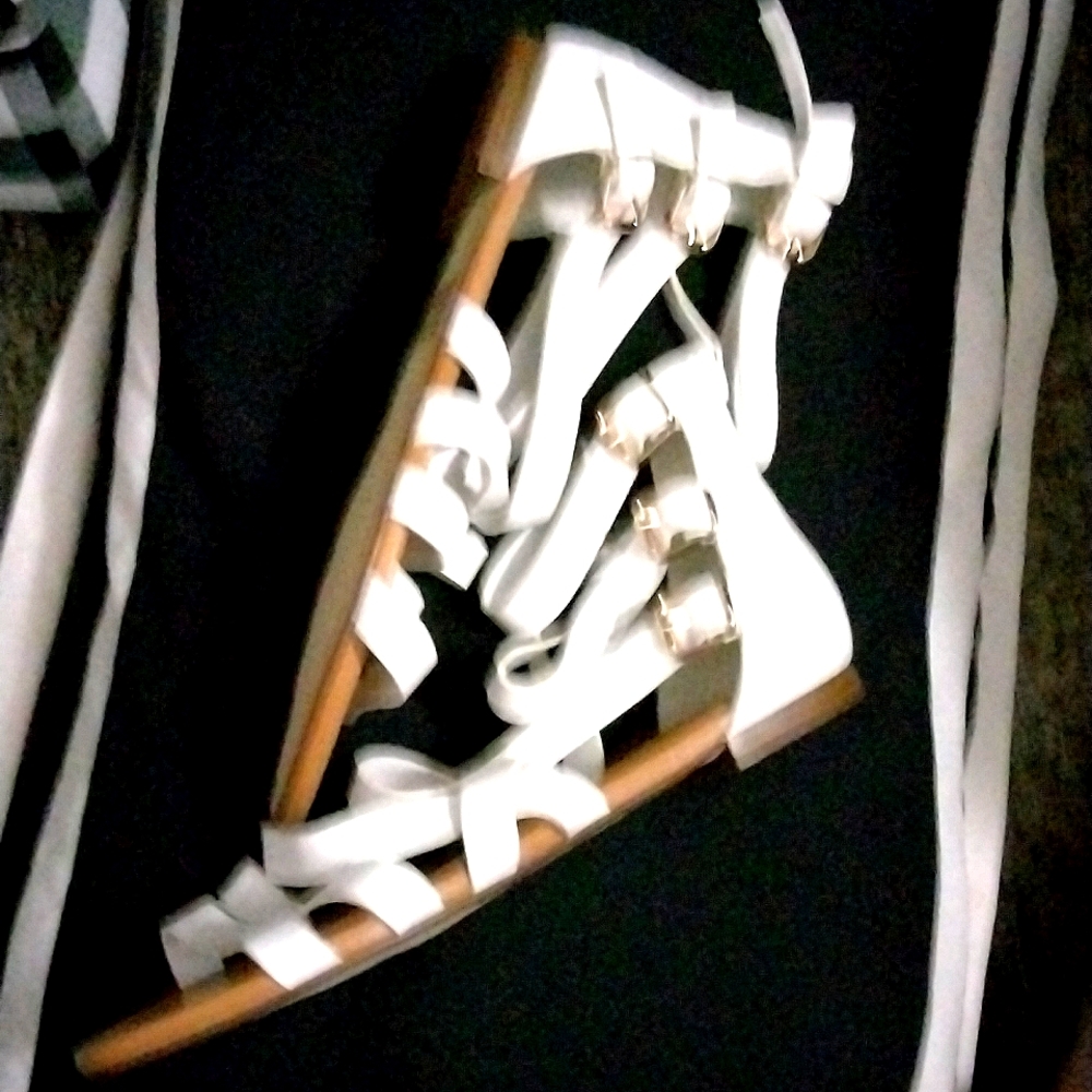 A pair of never worn white open-toe flat Sanders